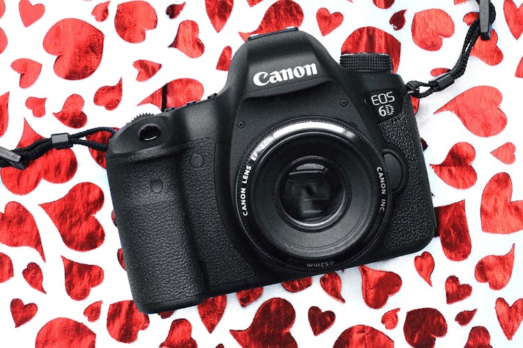 Black Canon Eos 6d Camera On Red And White Surface