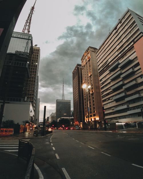 Free Stunning dusk view of São Paulo's urban skyline, capturing high-rise buildings and cloudy skies. Stock Photo