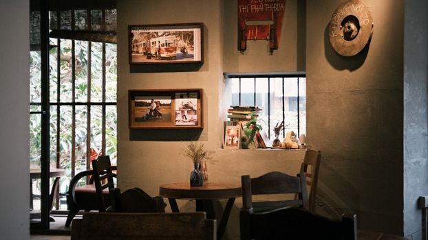 Warm and inviting interior of a rustic cafe featuring vintage decor, perfect for relaxing.