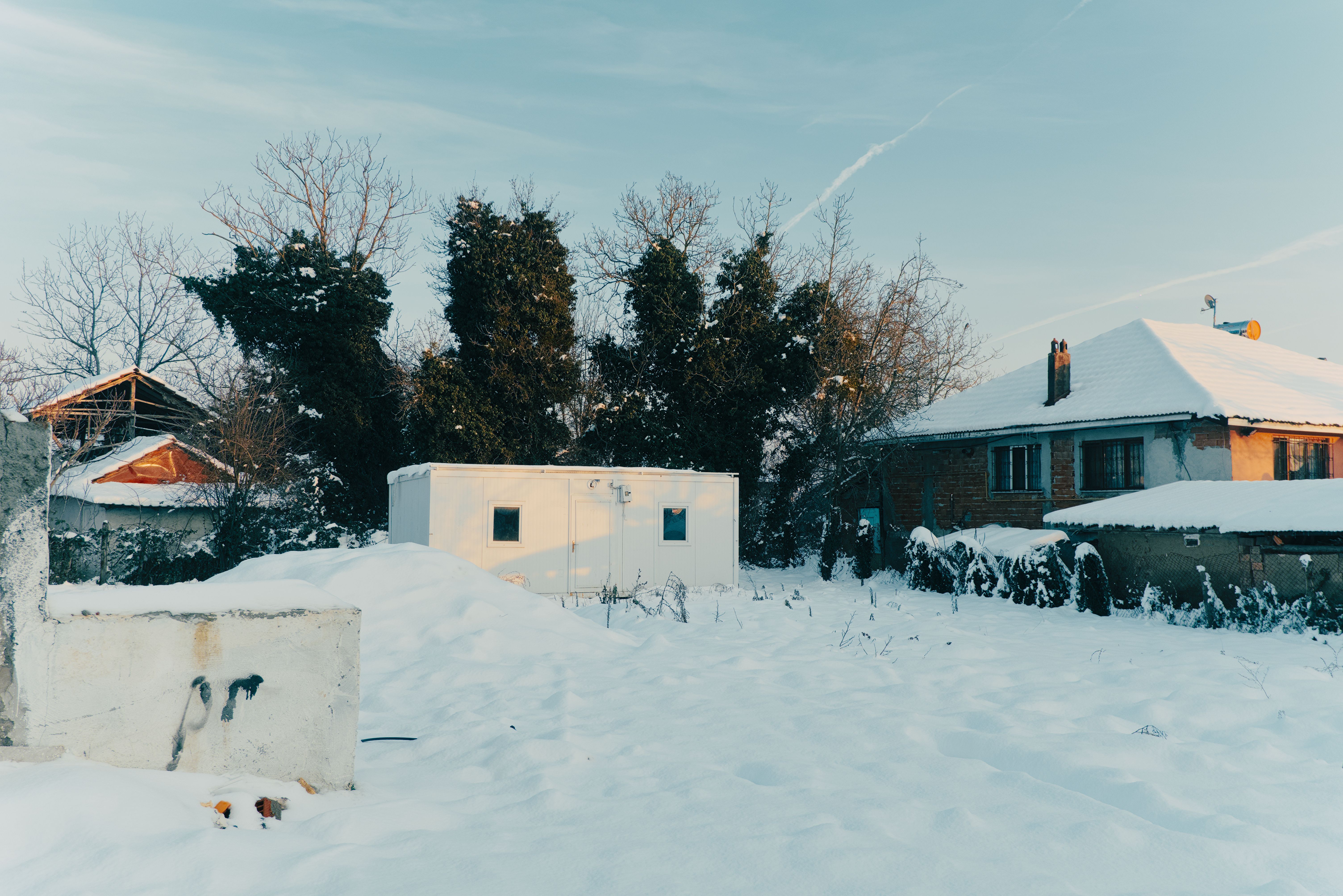 Snow-Covered Countryside House in Winter · Free Stock Photo