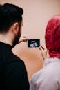 Couple Holding Ultrasound Image in Anticipation