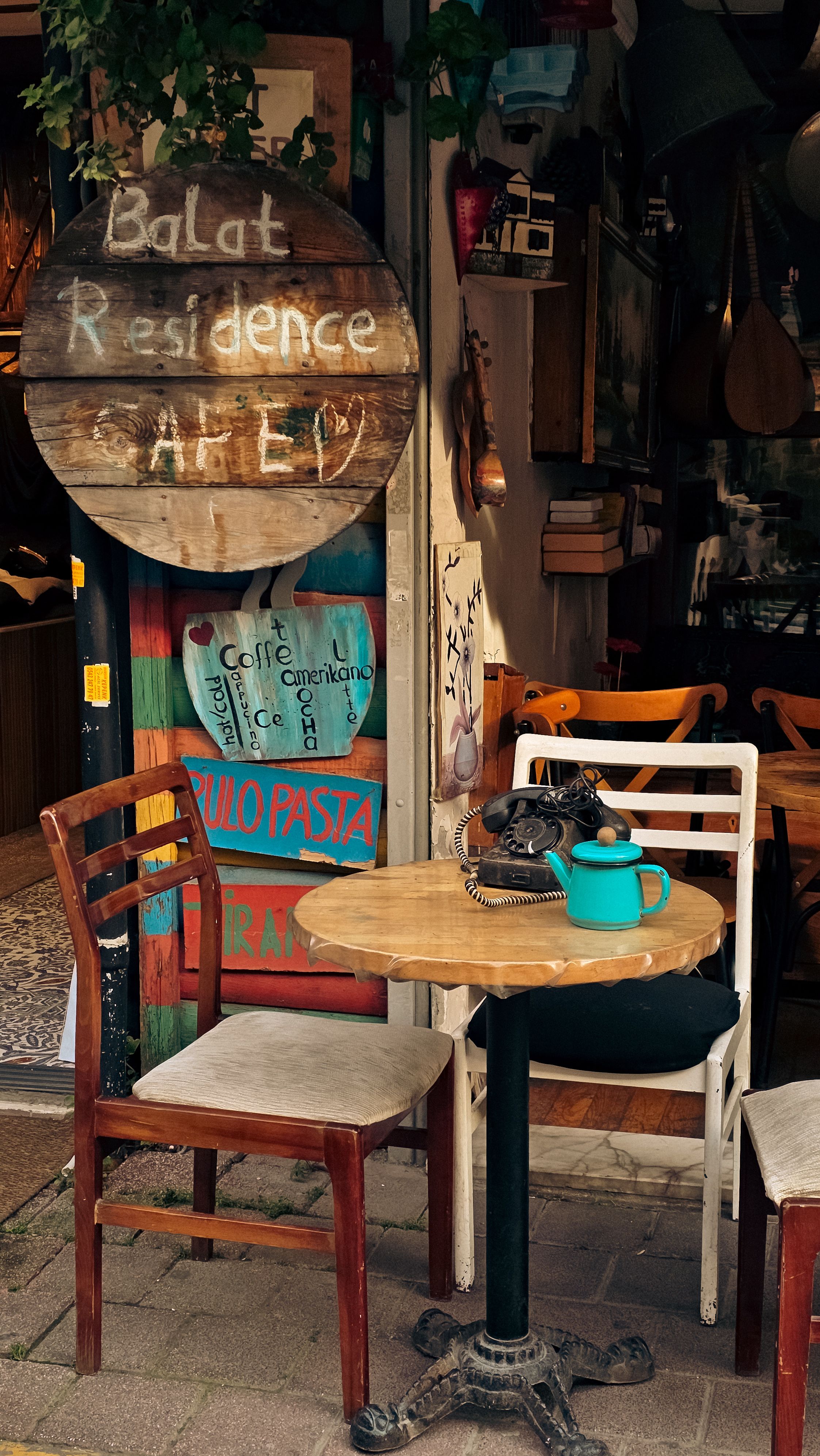 Cozy outdoor seating at a charming café in Balat, featuring rustic decor and inviting ambiance.
