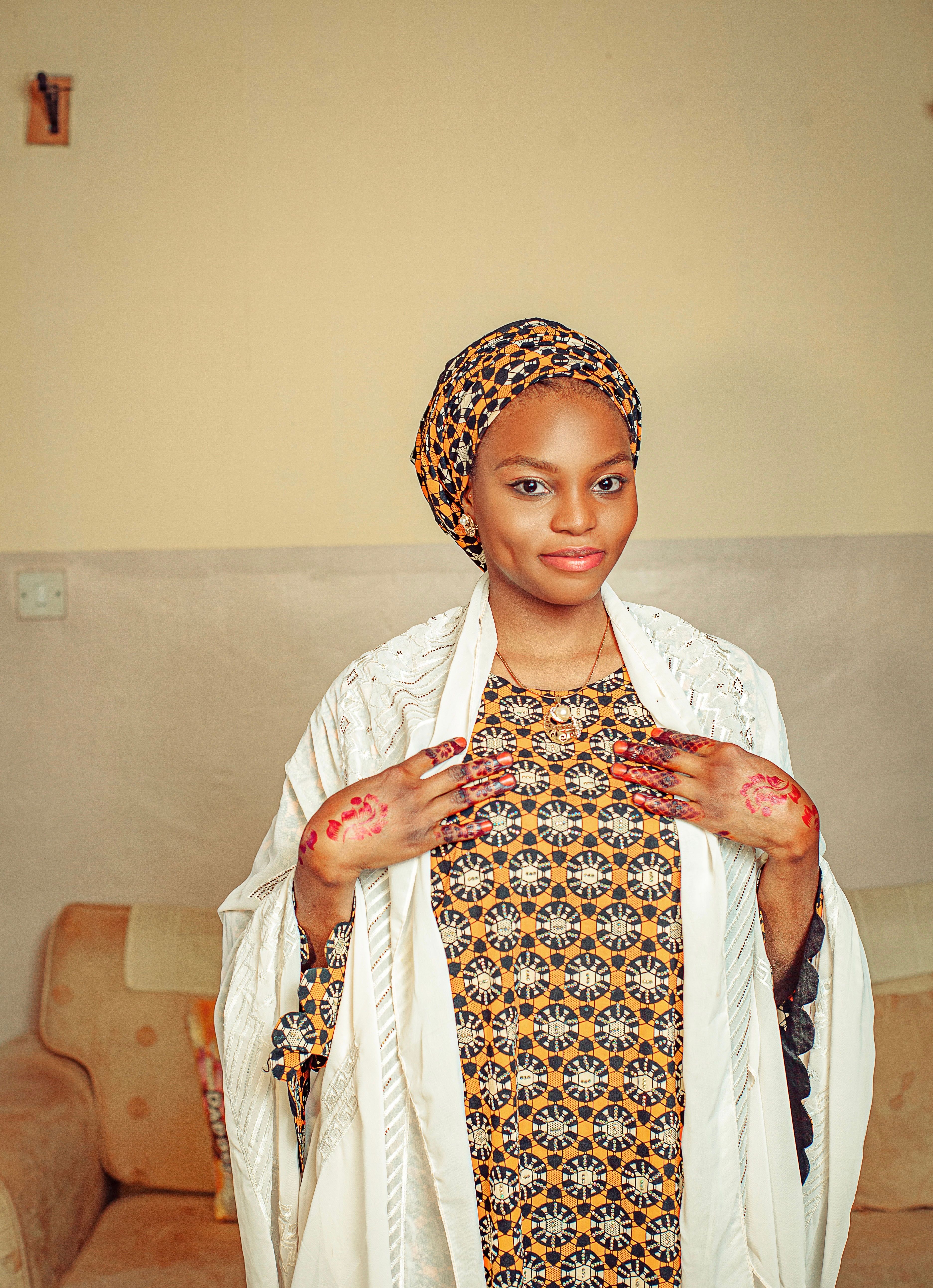 Elegant Woman in Traditional African Attire Indoors · Free Stock Photo
