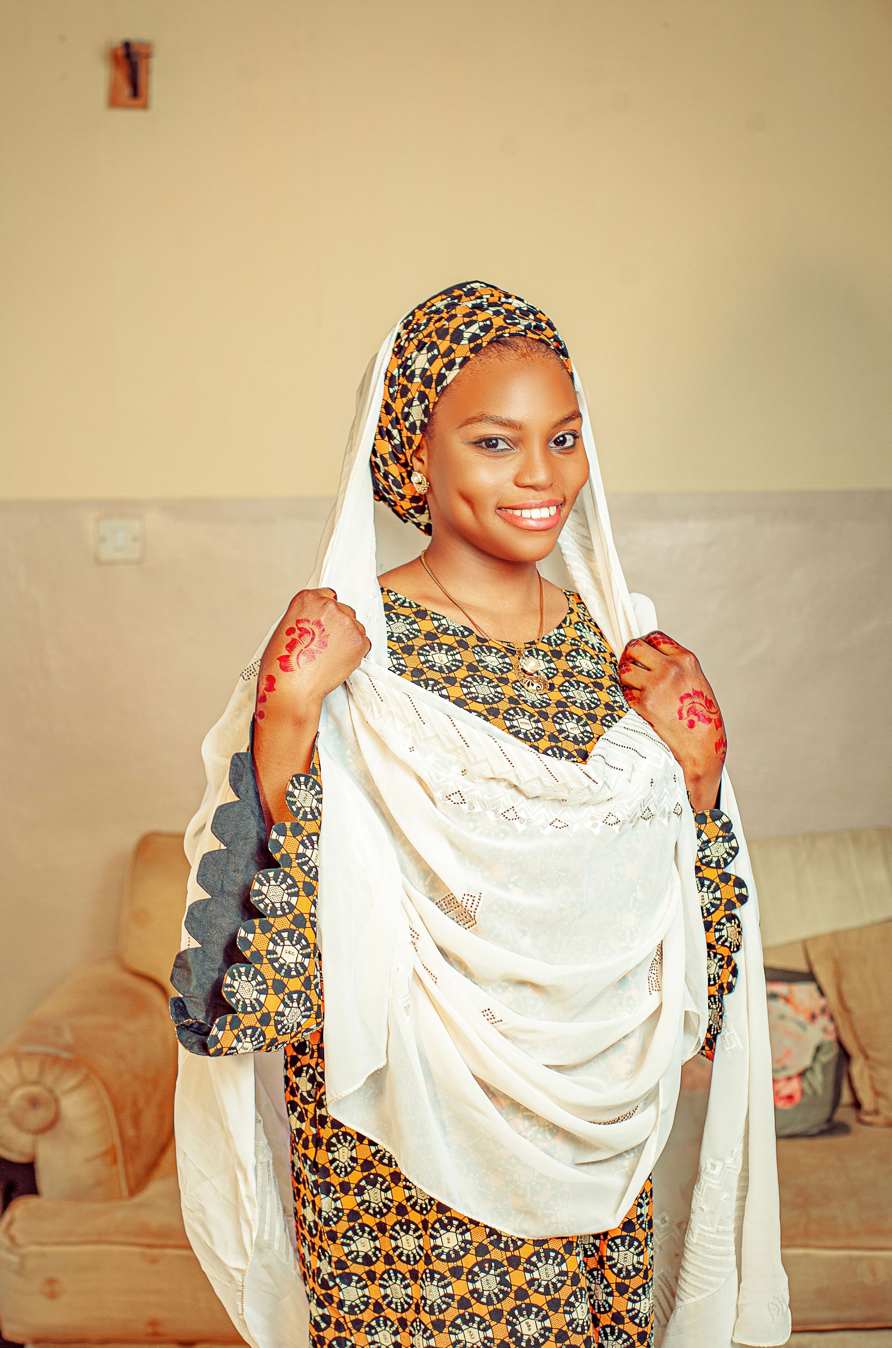 Elegant Woman in Traditional African Attire Indoors · Free Stock Photo