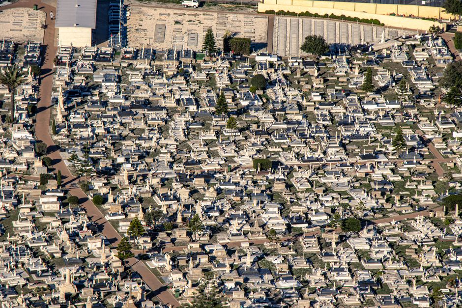 Aerial shot of a cemetery in Gibraltar showcasing intricate grave layouts and pathways.