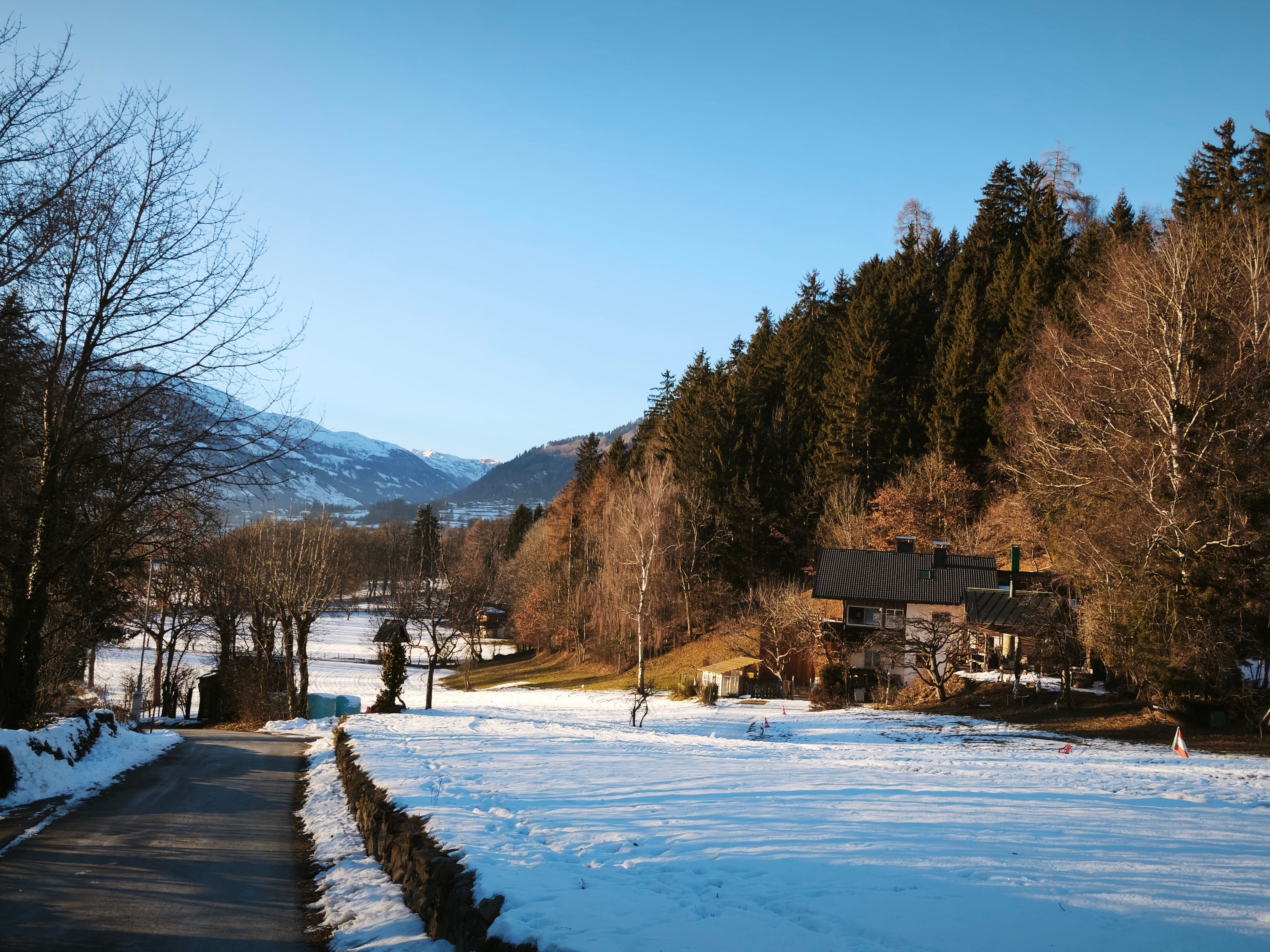 A snow-covered valley road in the Tyrol, on the run over the border