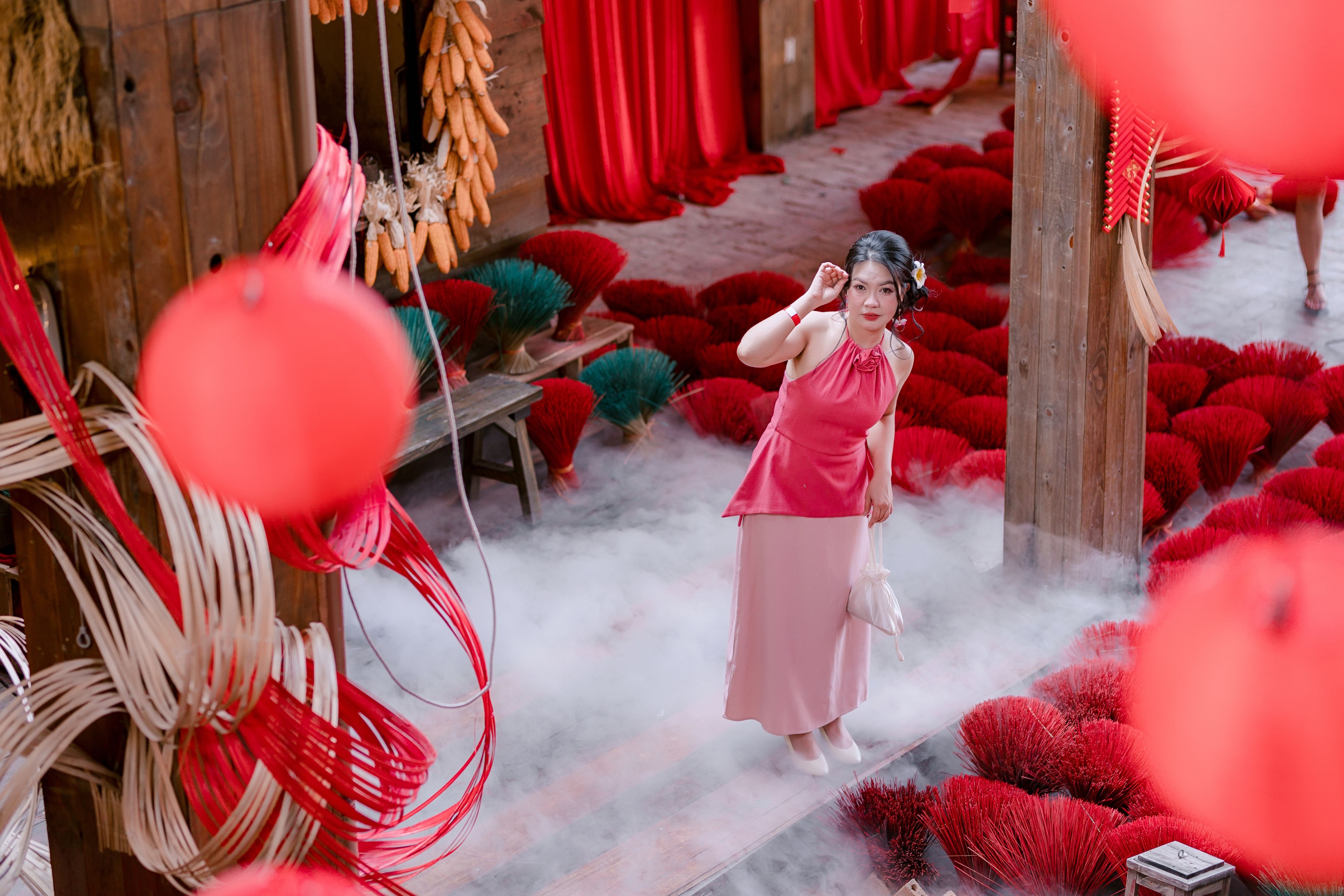 Woman in Traditional Asian Setting with Red Decor · Free Stock Photo