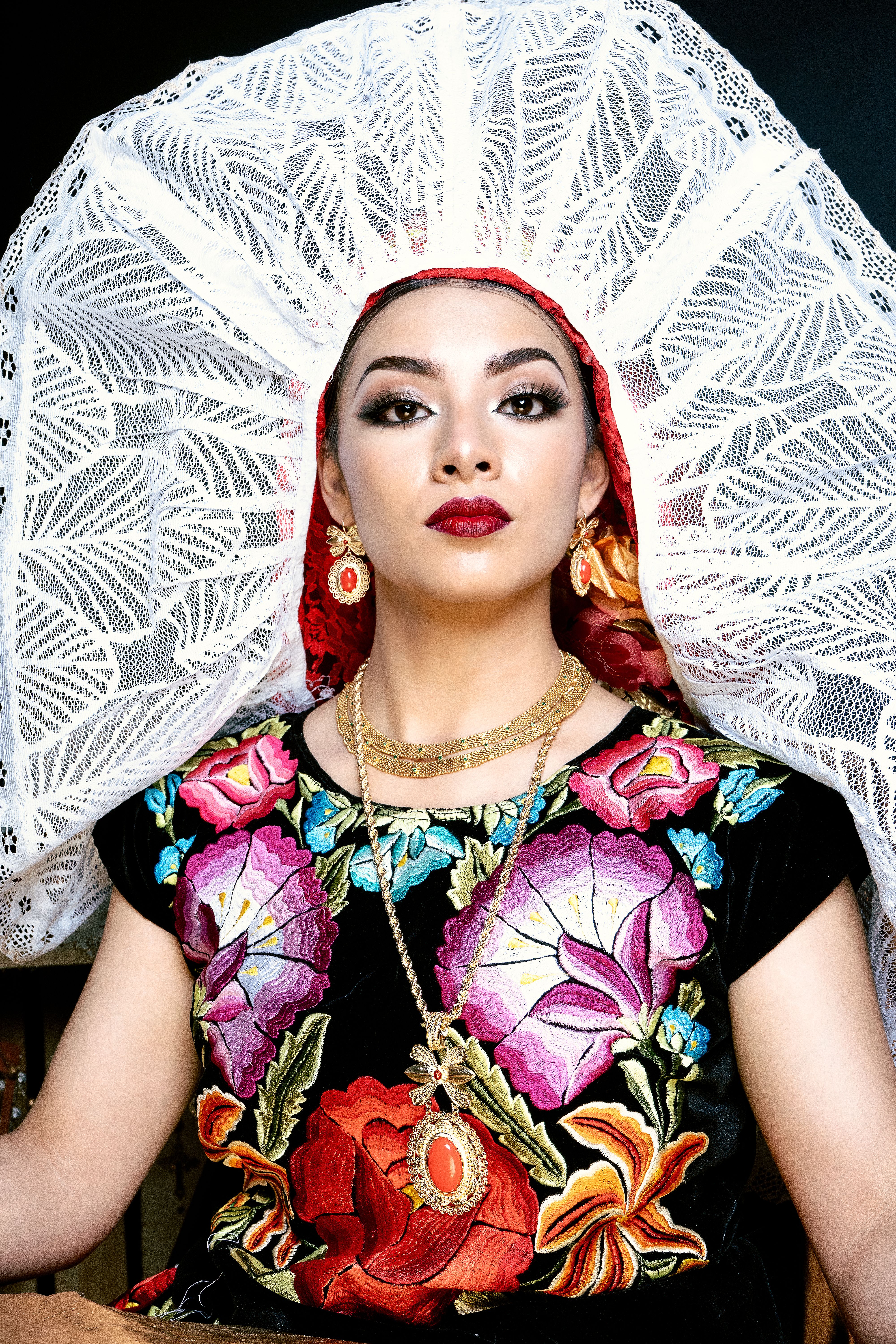 Stunning portrait showcasing vibrant Mexican traditional attire and intricate embroidery.