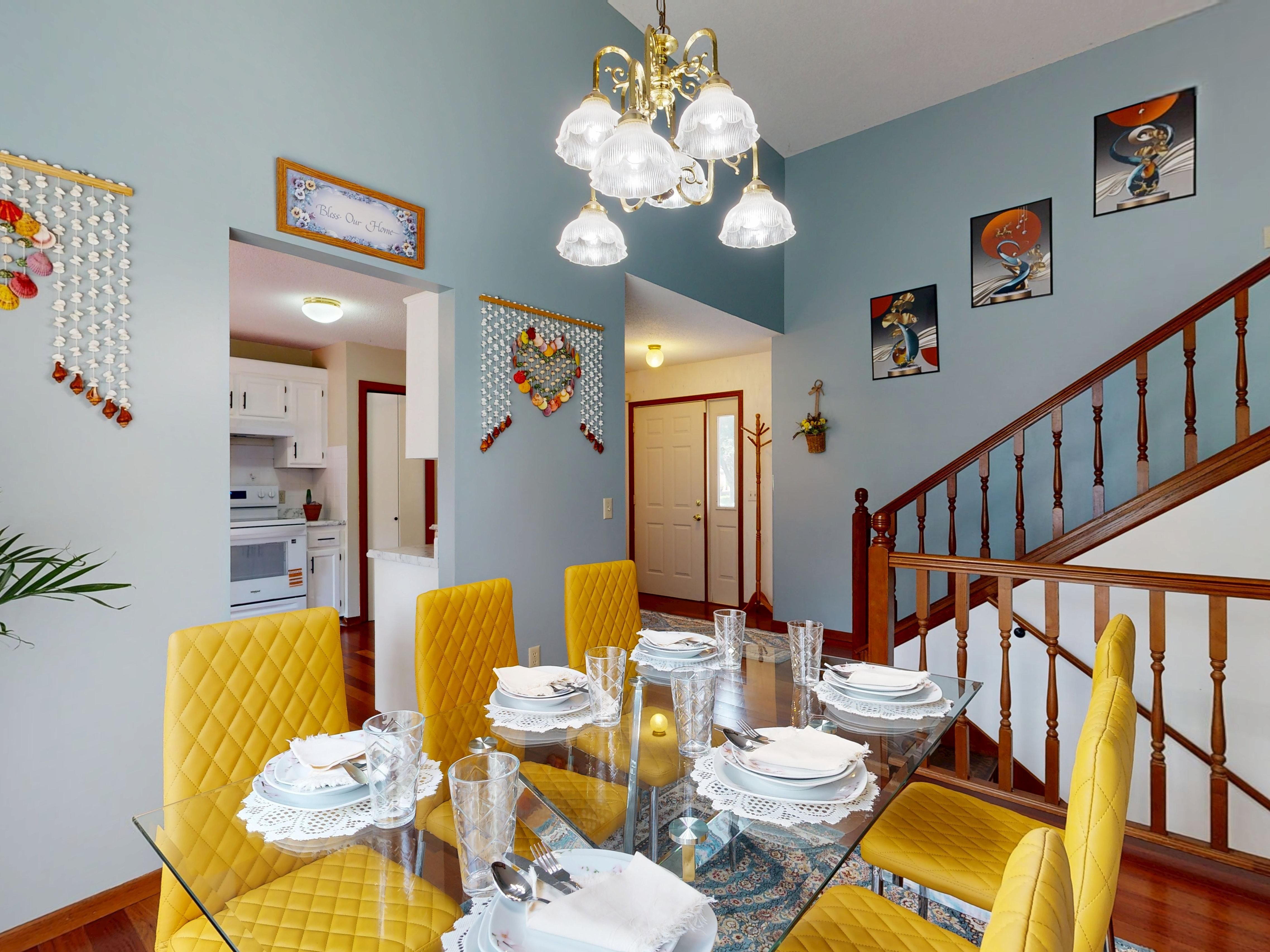 Elegant Dining Room with Glass Table and Yellow Chairs · Free Stock Photo