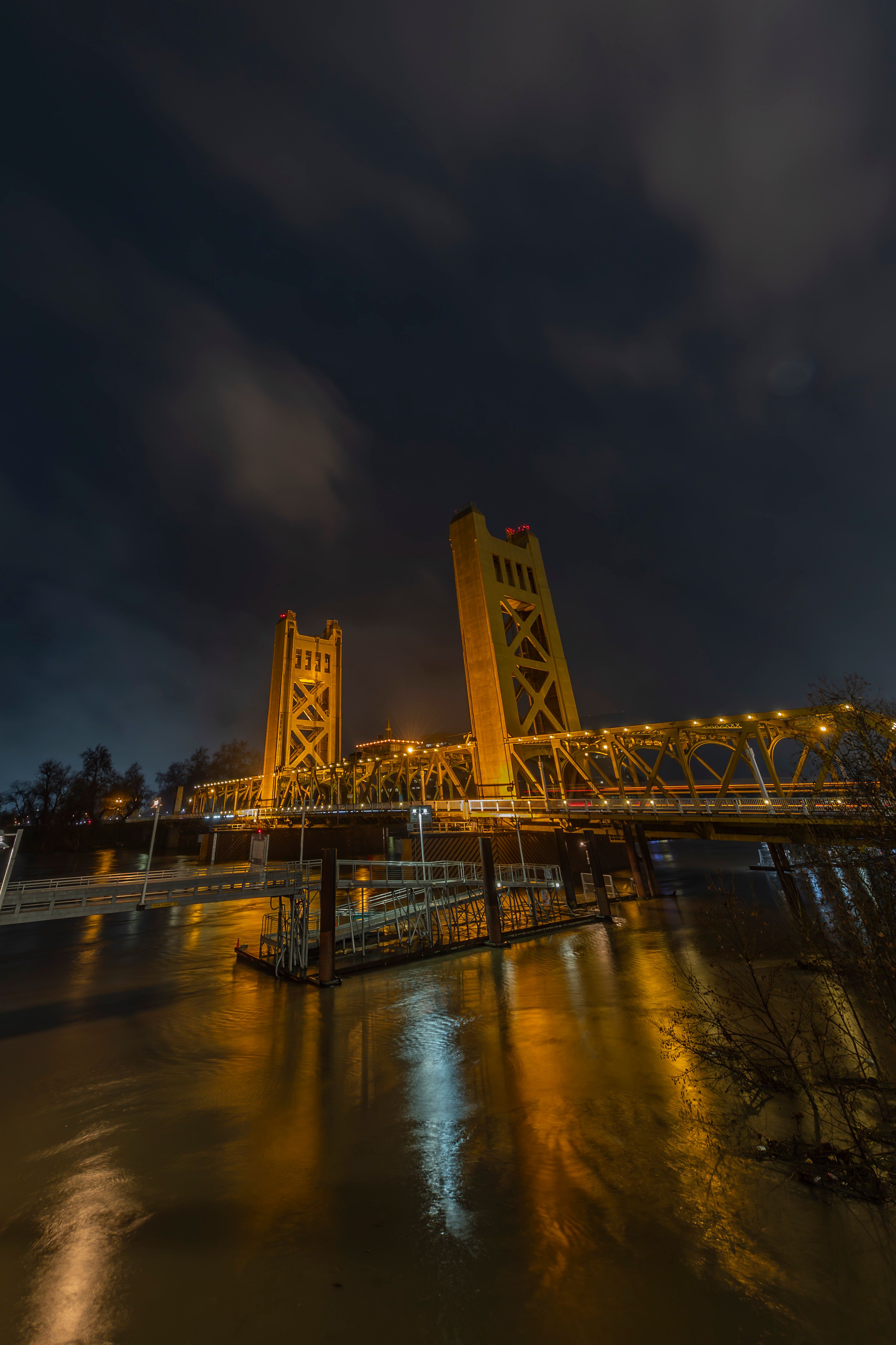 Sacramento Tower Bridge at Night Reflecting Lights · Free Stock Photo