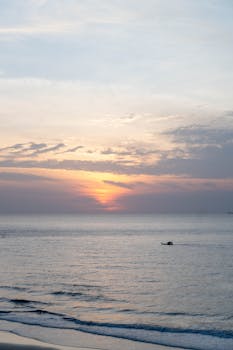 Captivating sunrise over Vũng Tàu's calm sea, showcasing serene natural beauty.