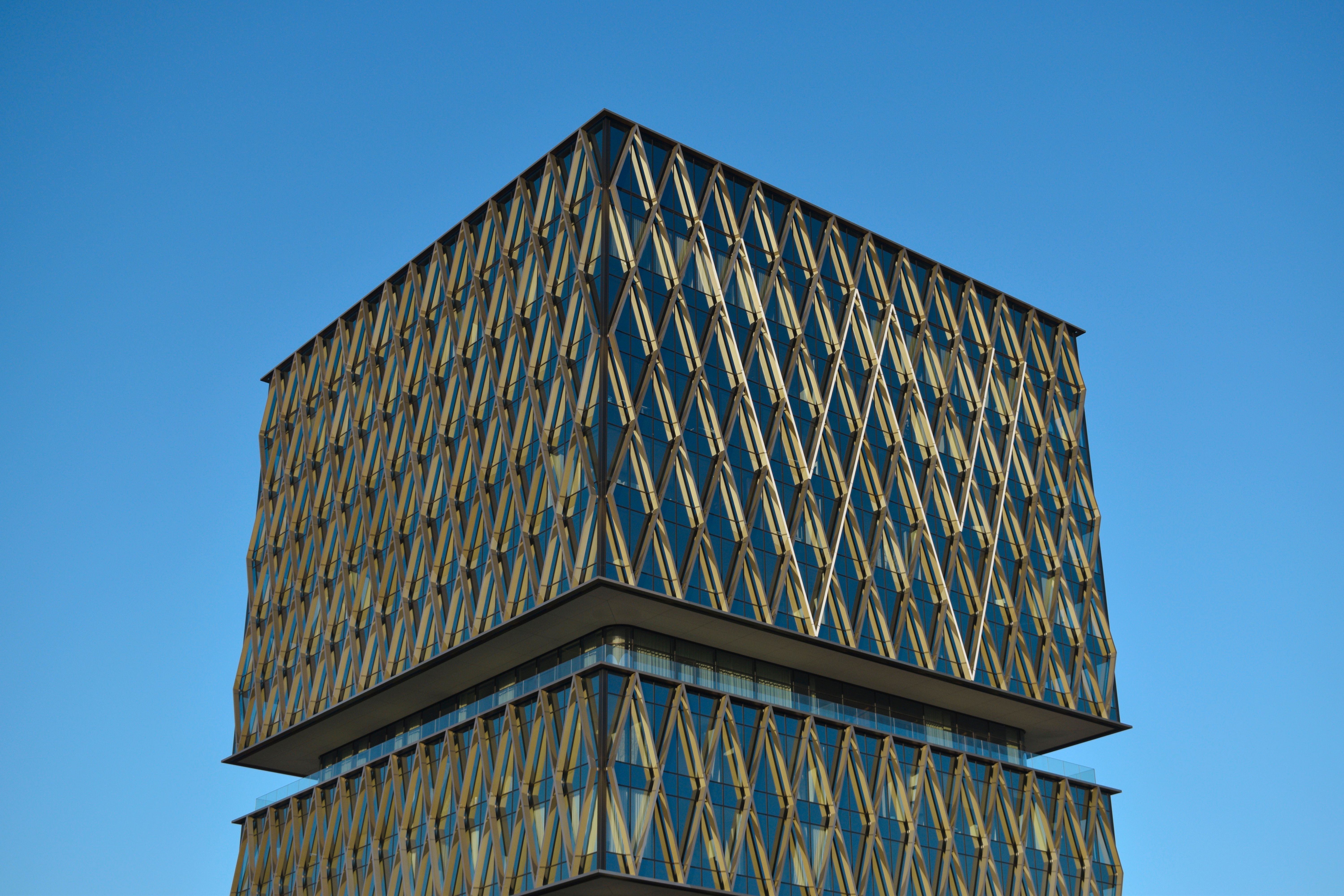Modern Geometric Building against Clear Sky · Free Stock Photo