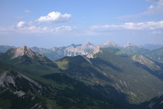 Stunning view of an alpine mountain range under a clear blue sky, ideal for nature lovers.