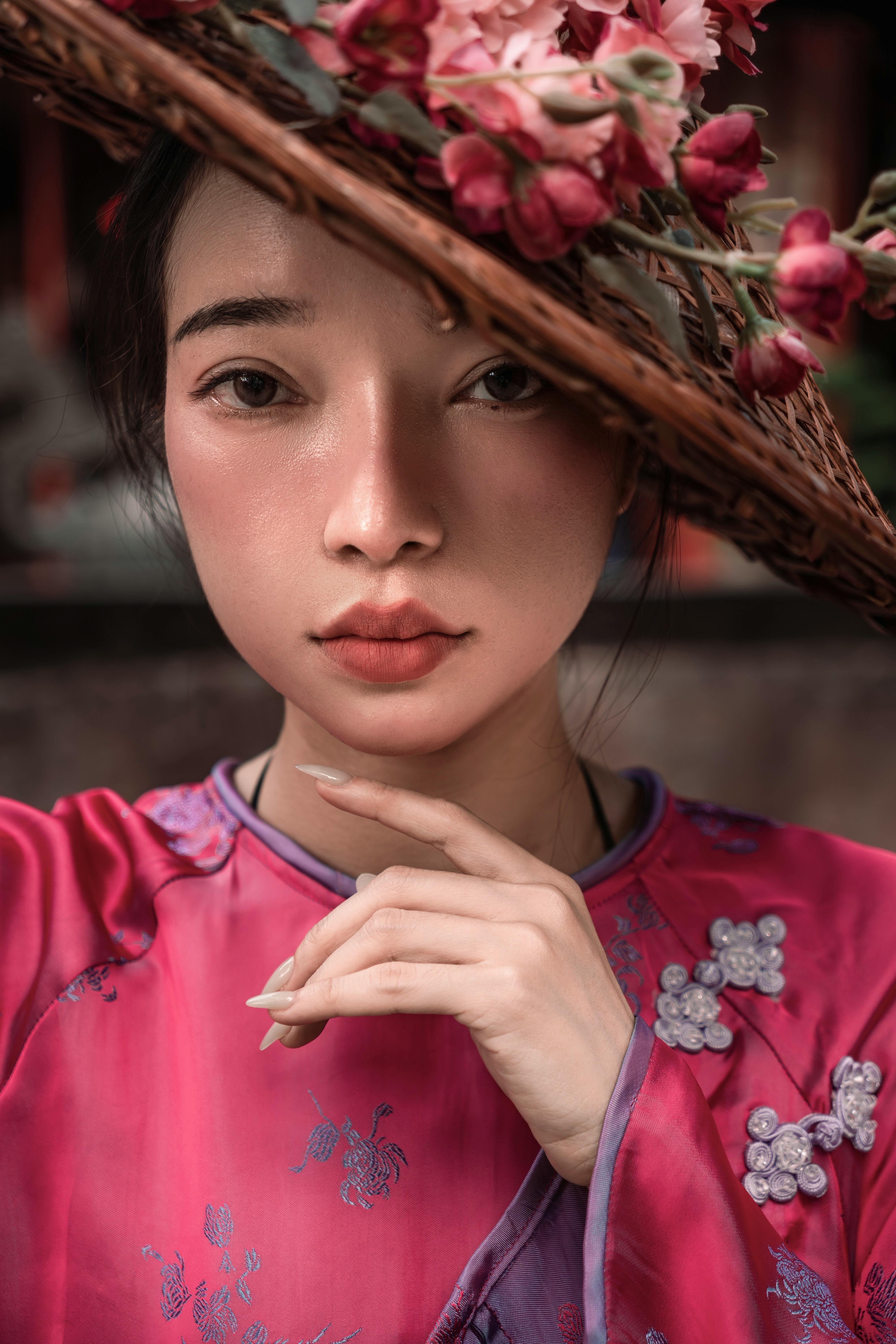 Elegant portrait of a woman in traditional Vietnamese attire with floral hat, enriched with cultural