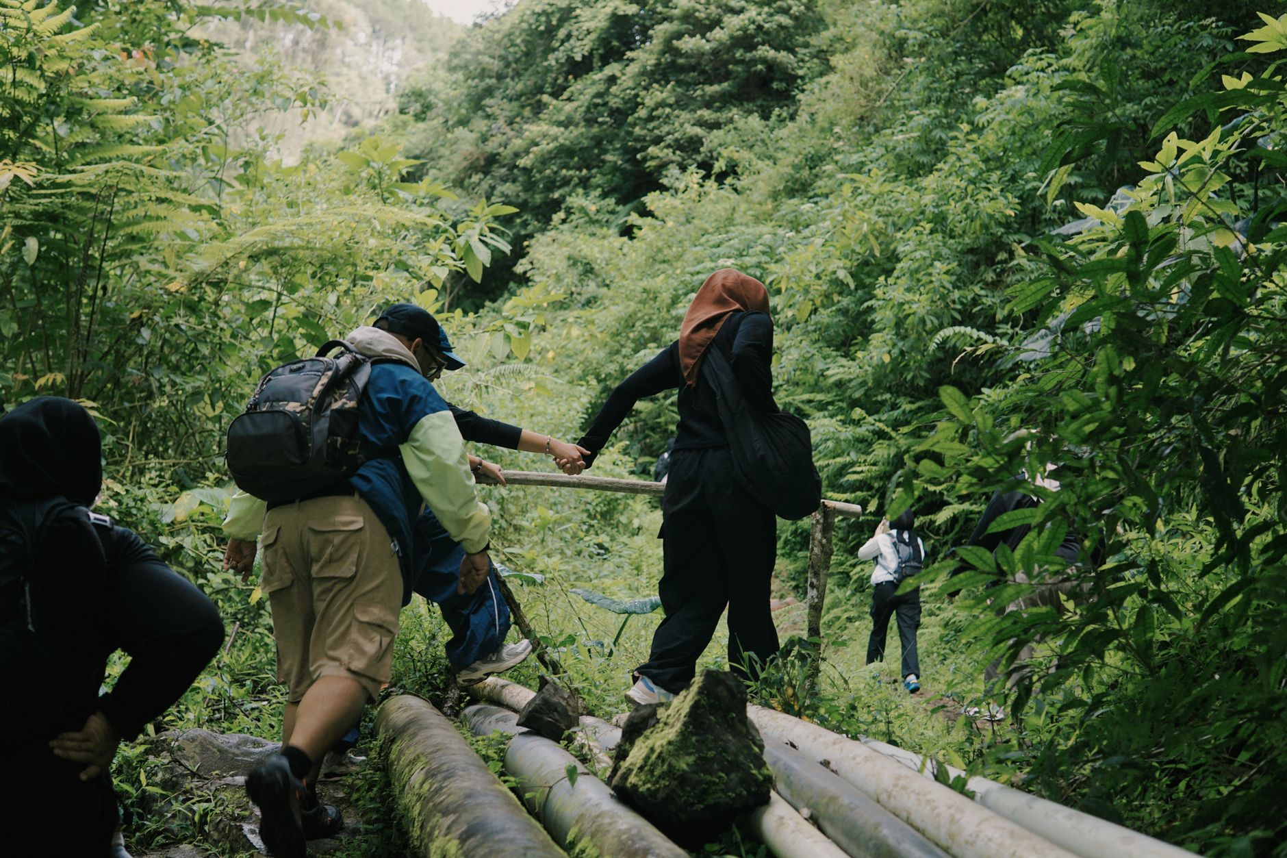 Eco-conscious tourists engaging in sustainable tourism practices in nature
