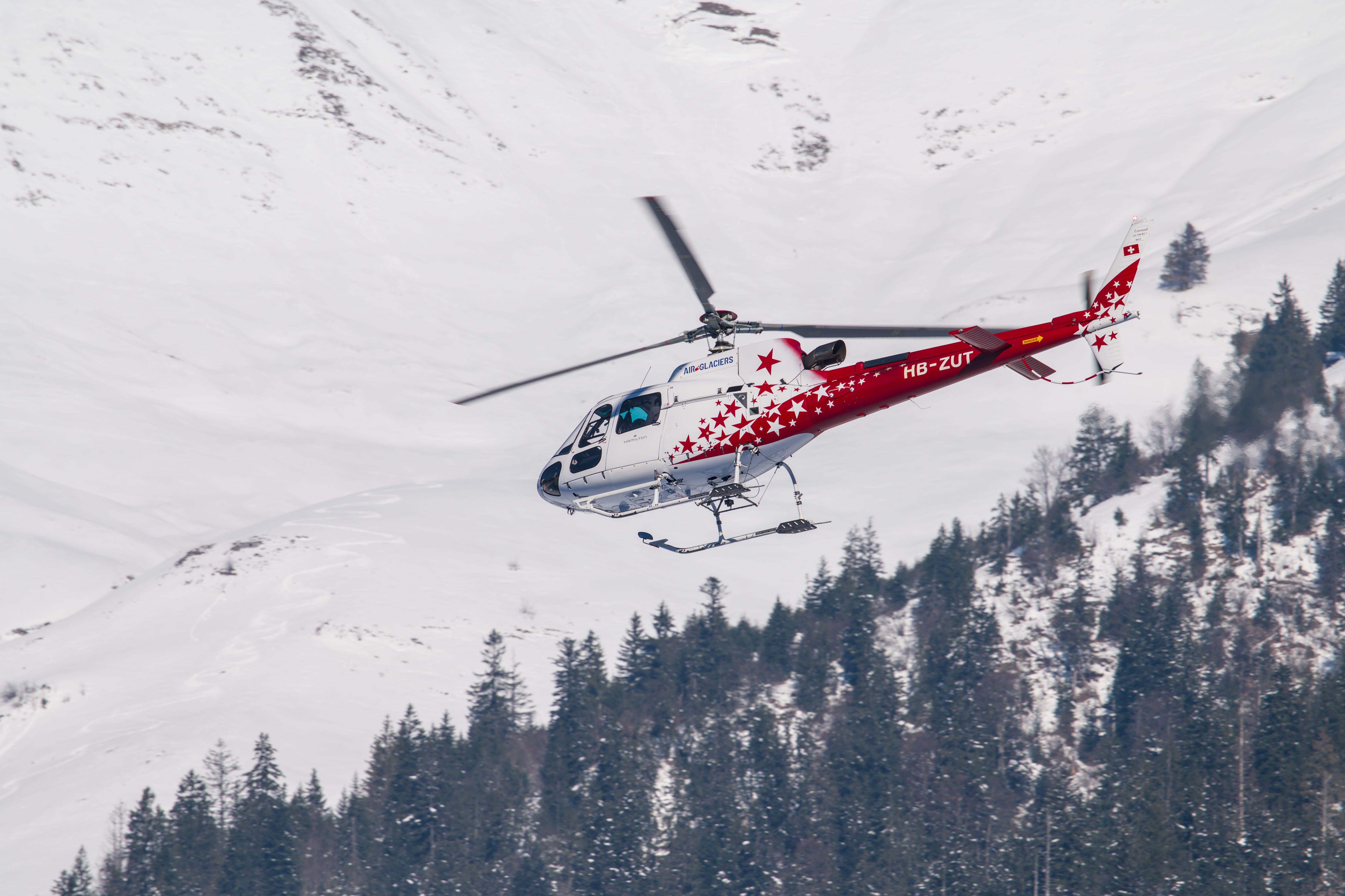 Helicopter Flying Over Snowy Swiss Alps · Free Stock Photo
