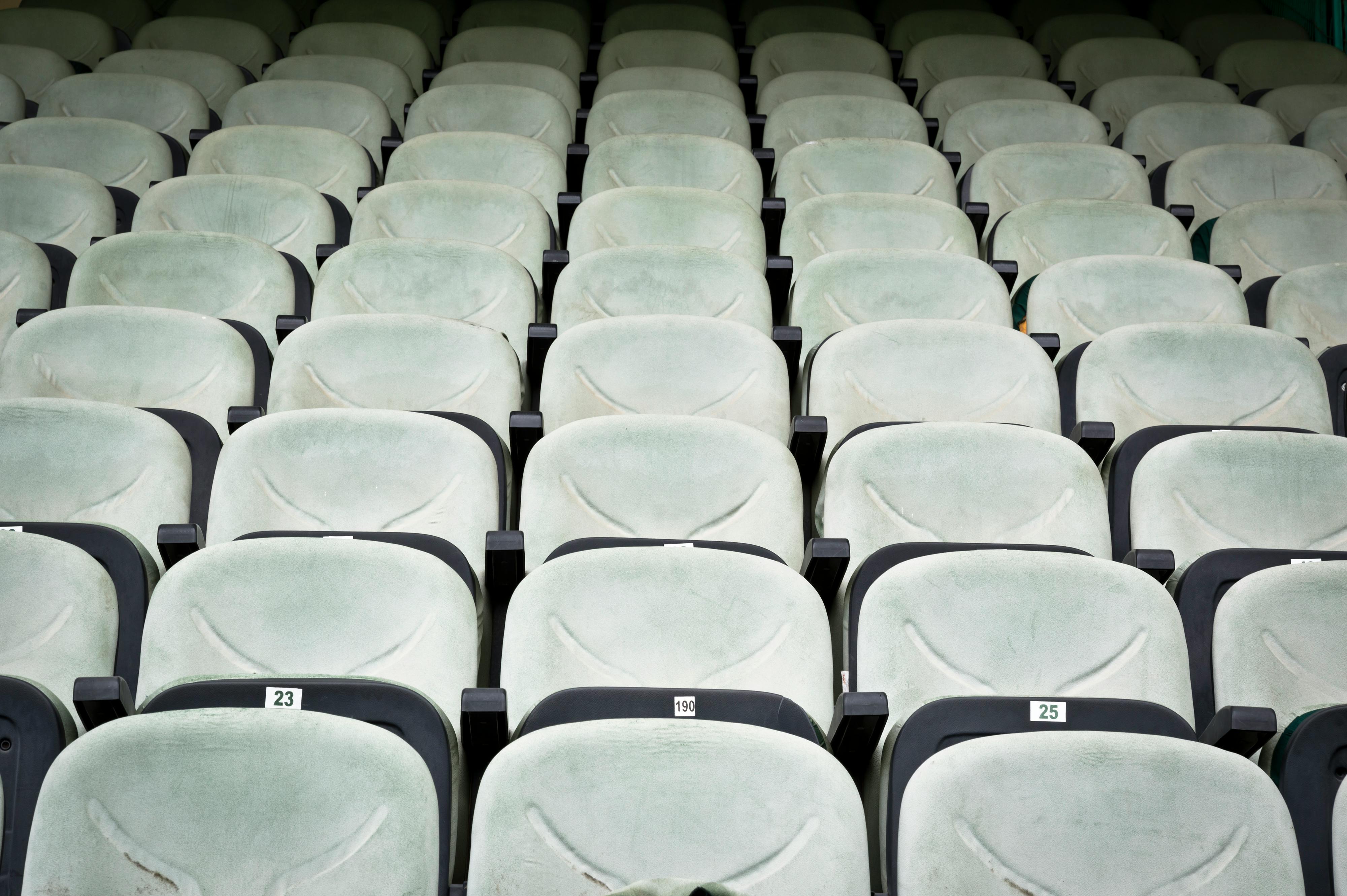 Free Rows of empty white seats in a cinema, perfect for concepts like solitude or seminar setups. Stock Photo