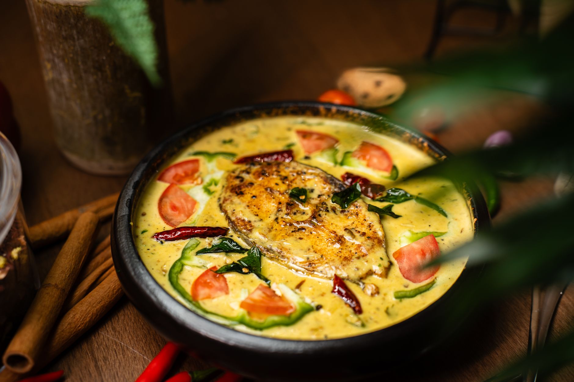 Madras Red Fish Curry in a bowl with coriander garnish
