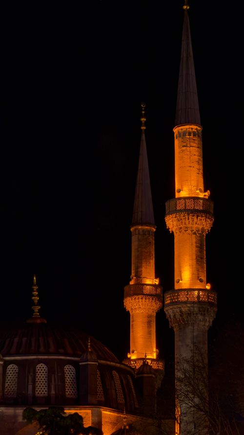 Free Night view of illuminated minarets at a mosque in Istanbul, Turkey. Stock Photo