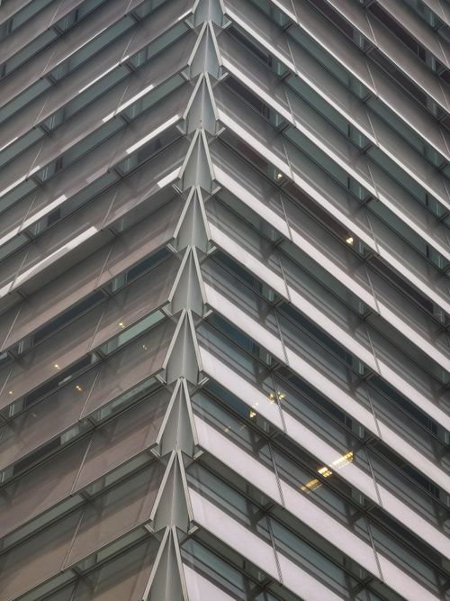 Free Diagonal view of a modern building with glass facade in Santiago, Chile. Stock Photo