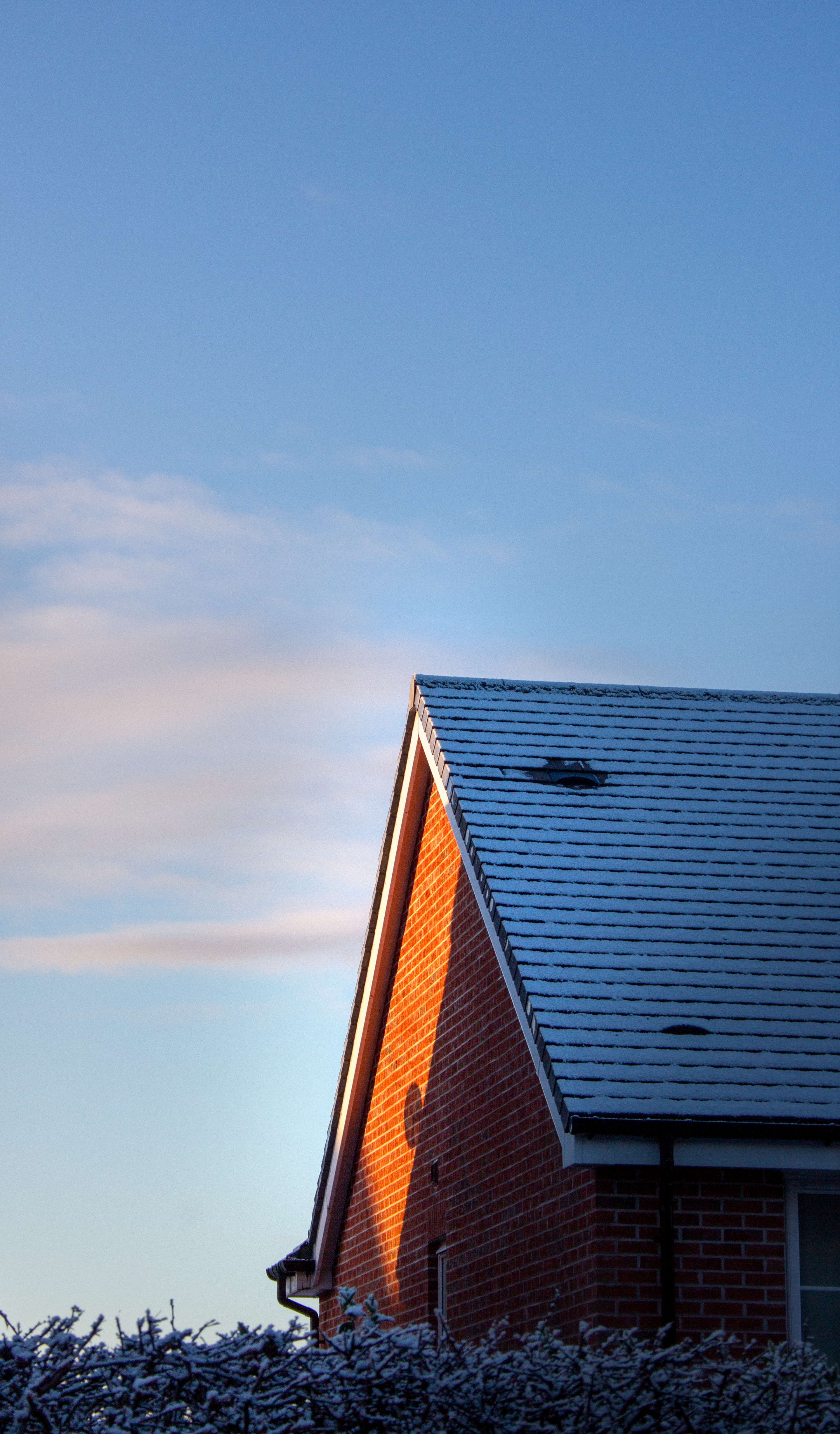 Snow-Covered Rooftop in English Winter Light · Free Stock Photo