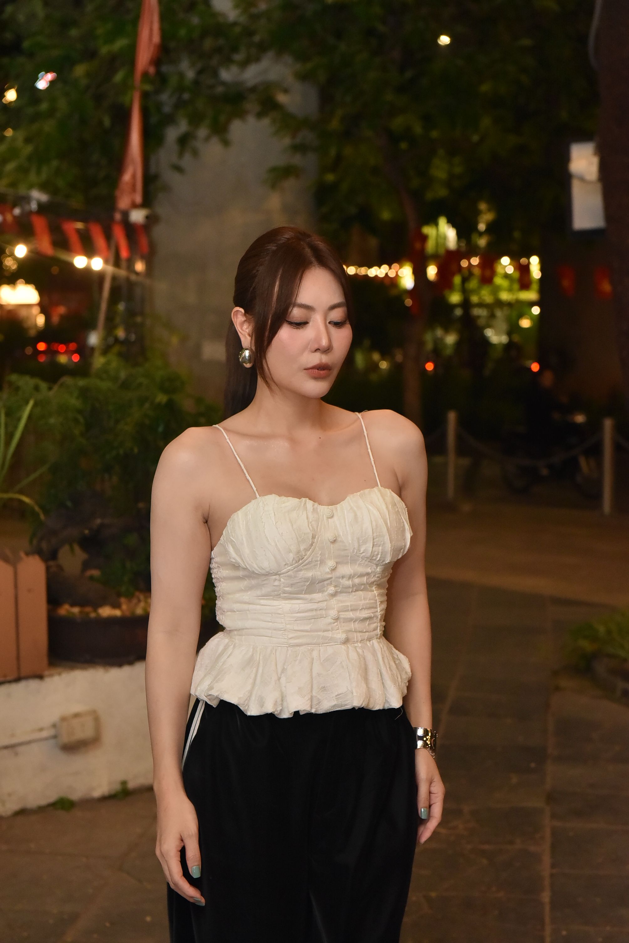 Elegant Woman Posing Outdoors at Night · Free Stock Photo