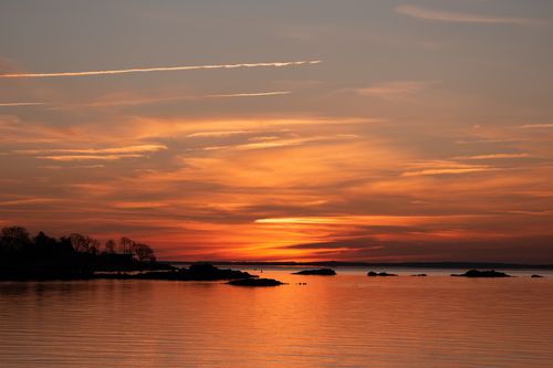 Free Stunning sunrise at Cove Island Park, Stamford, Connecticut with vibrant orange skies reflecting on serene waters. Stock Photo