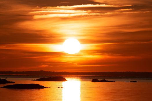 Breathtaking winter sunrise with vibrant colors at Stamford's Cove Island Park.