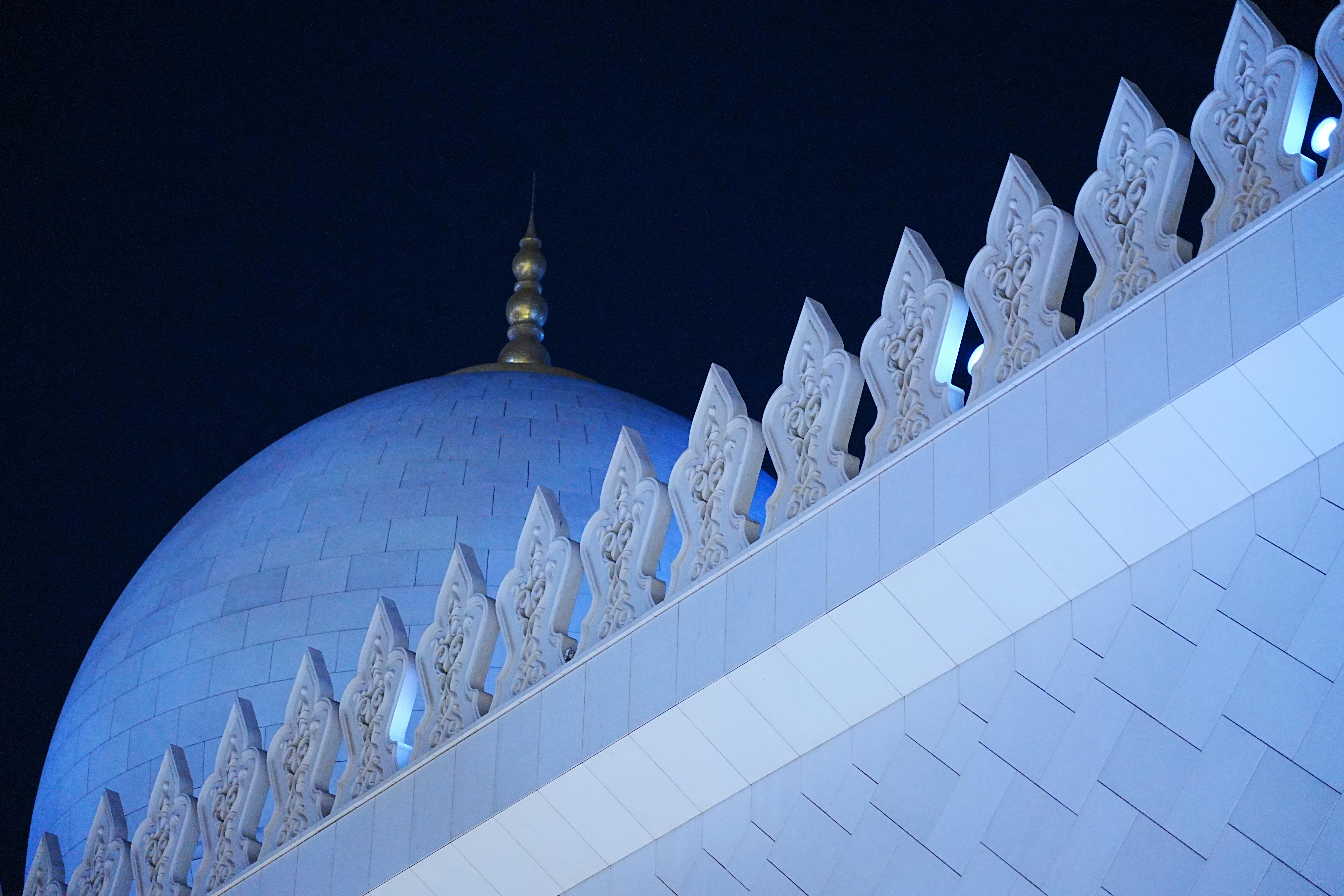 A striking view of the Sheikh Zayed Grand Mosque's dome under the night sky in Abu Dhabi.