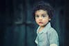 Free Toddle Wearing Gray Button Collared Shirt With Curly Hair Stock Photo
