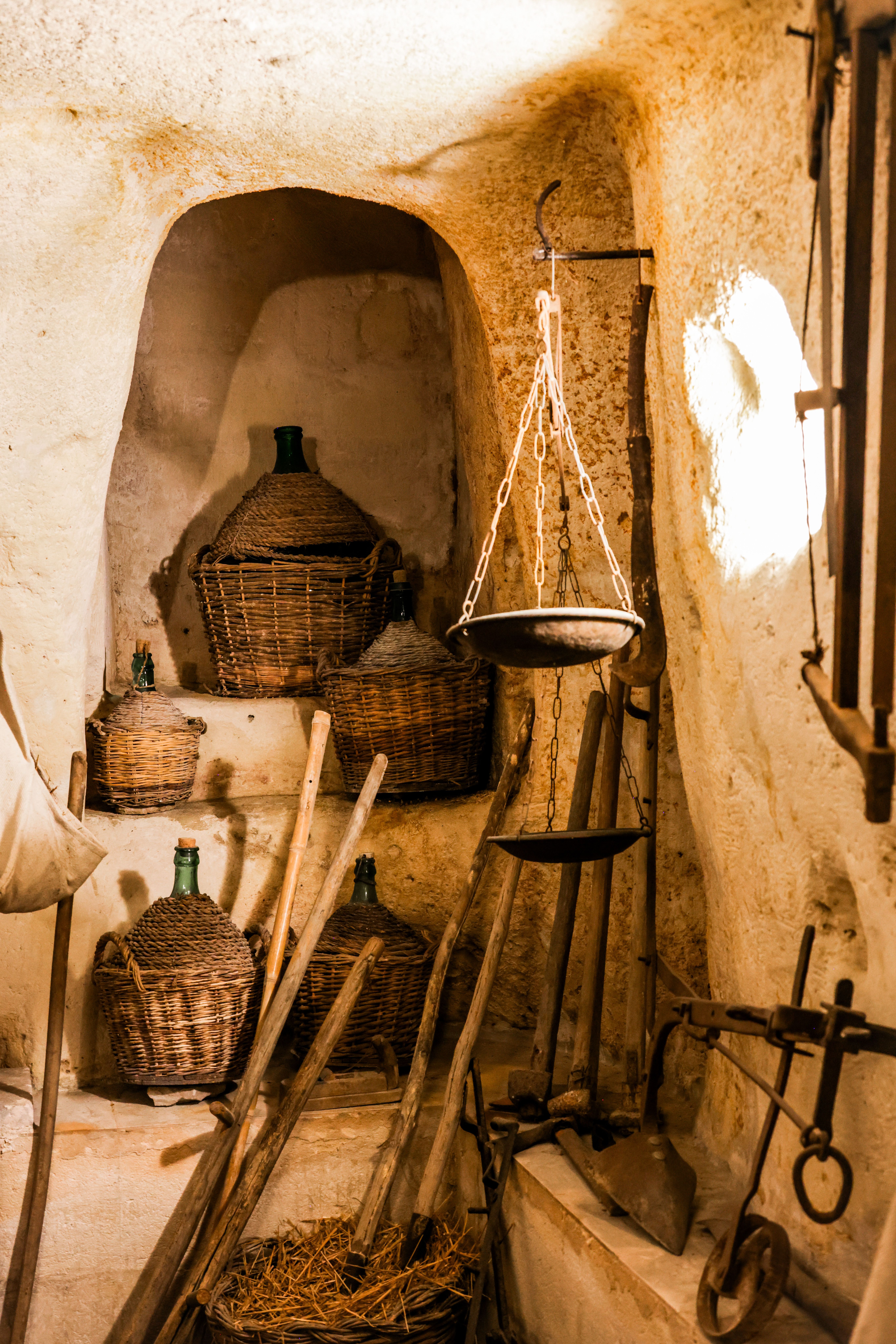 Traditional Italian cave cellar demonstrating subterranean thermal stability