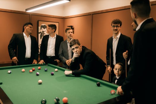 Group of businessmen enjoying a game of billiards indoors.