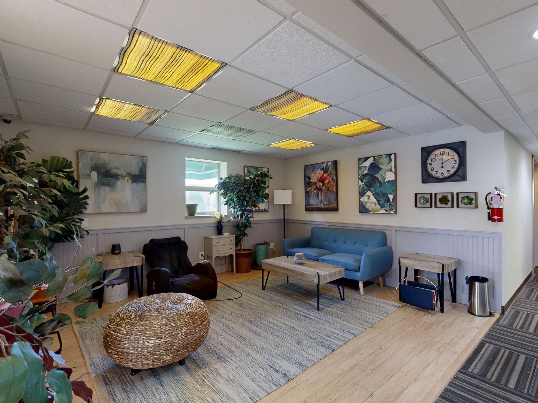A modern lounge room with chic decor and ambient lighting, perfect for relaxation.