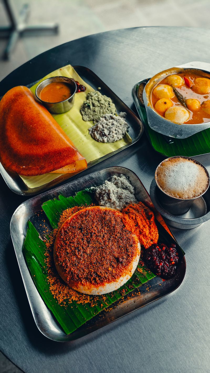 South Indian breakfast of dosa and idli with chutneys