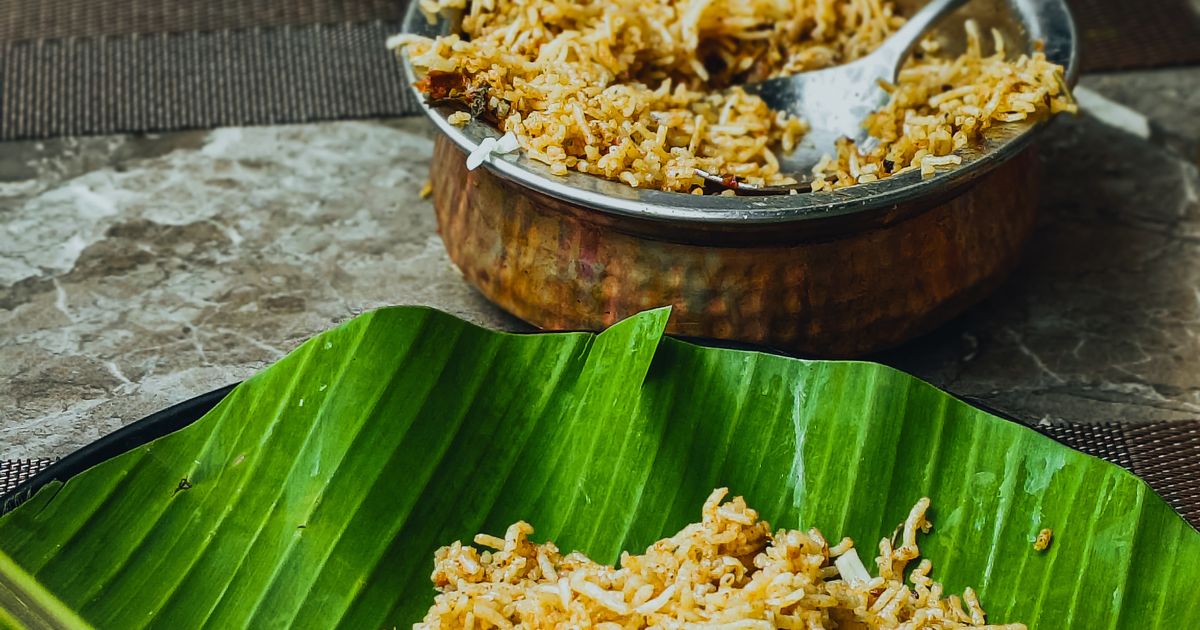 Biryani served on banana leaves with boiled egg (Central Kitchen Catering in Vellore)