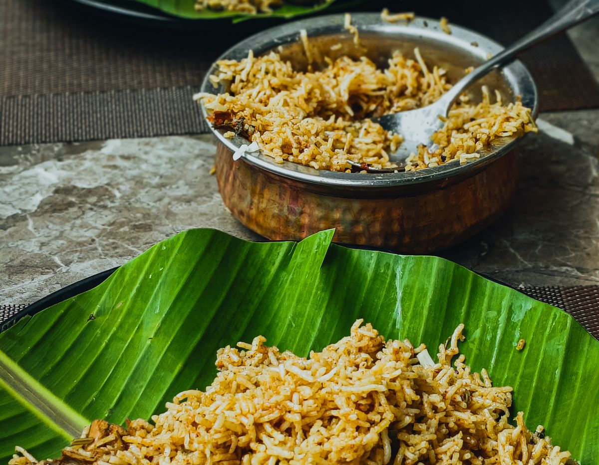 Biryani served on banana leaves with boiled egg
