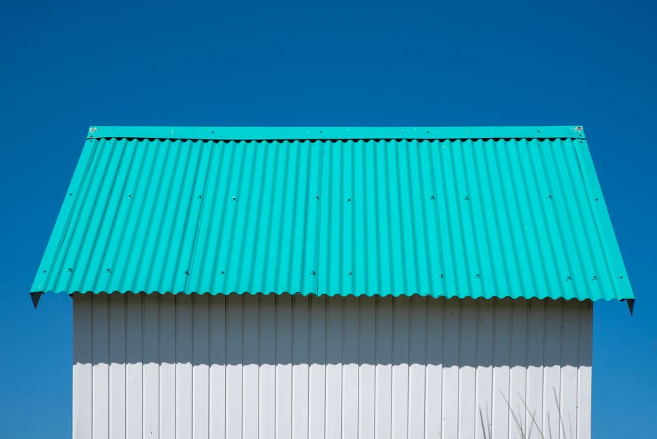 a modern metal roof installation on a Pacific Northwest home a modern metal roof installation on a Pacific Northwest home