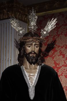 Detailed statue of Jesus Christ with crown of thorns inside a church in Torremolinos.