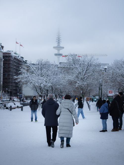 Free A winter scene in Hamburg with people walking and the iconic Television Tower in the background. Stock Photo