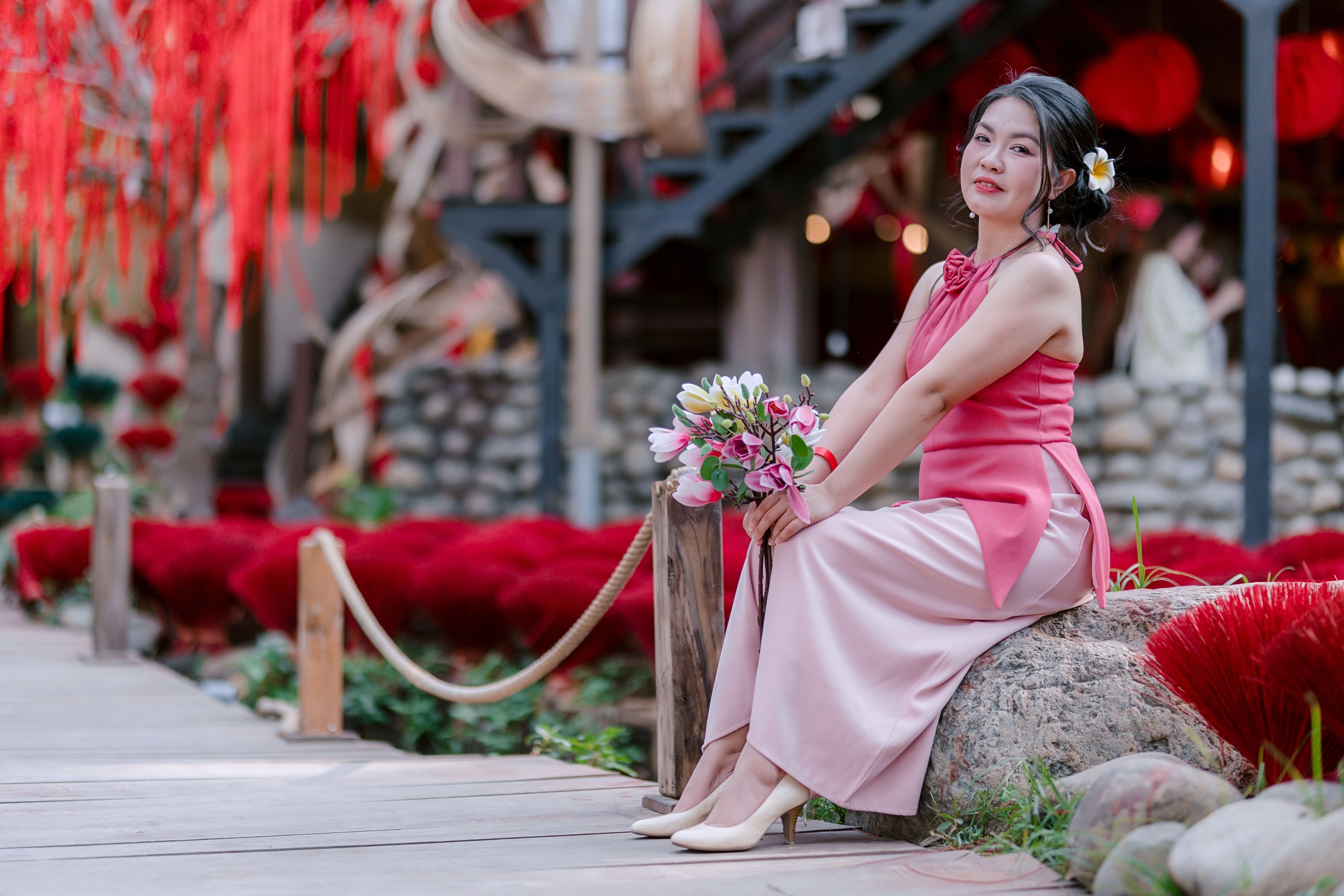 Elegant Woman in Pink Dress Posing Outdoors · Free Stock Photo