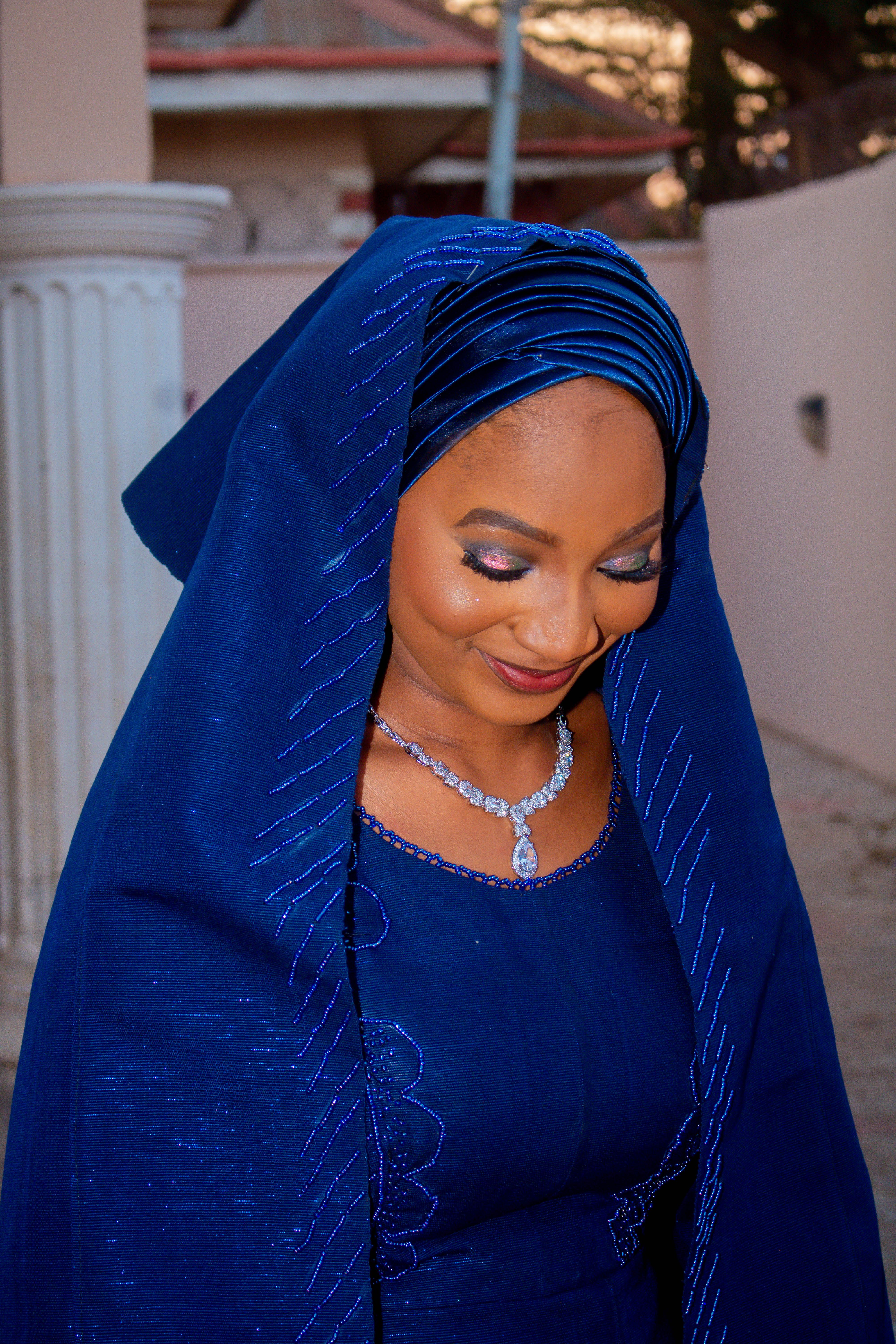 Elegant Portrait of Woman in Blue Hijab Outdoors · Free Stock Photo