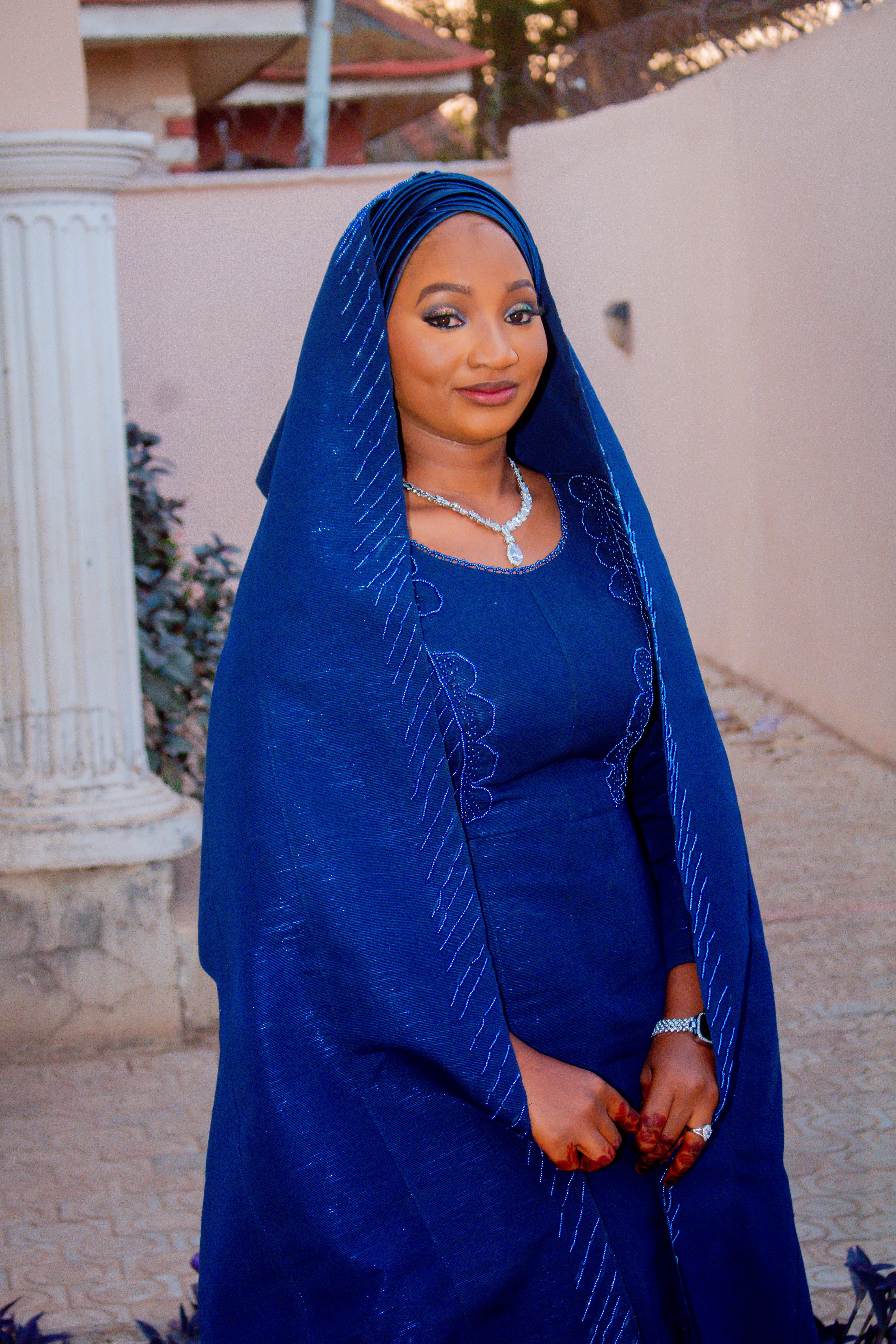 Elegant Woman in Traditional Blue Attire Outdoors · Free Stock Photo