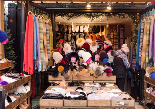 Free Colorful scarves and hats on display at a Toronto winter market stall. Stock Photo