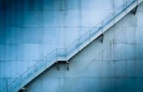 Industrial Metal Staircase on Blue Wall