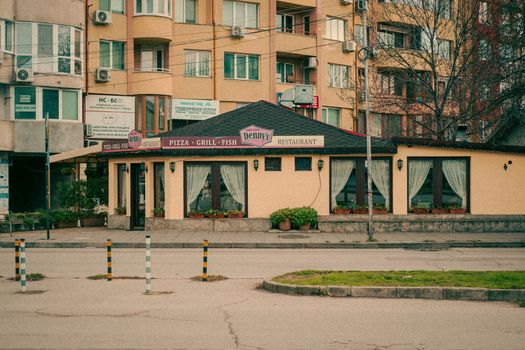 Charming streetfront restaurant with vintage architecture in urban residential area, perfect for casual dining.