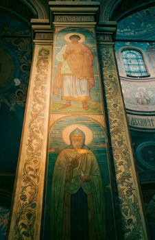 Intricate frescoes depicting saints in a historical Varna cathedral.