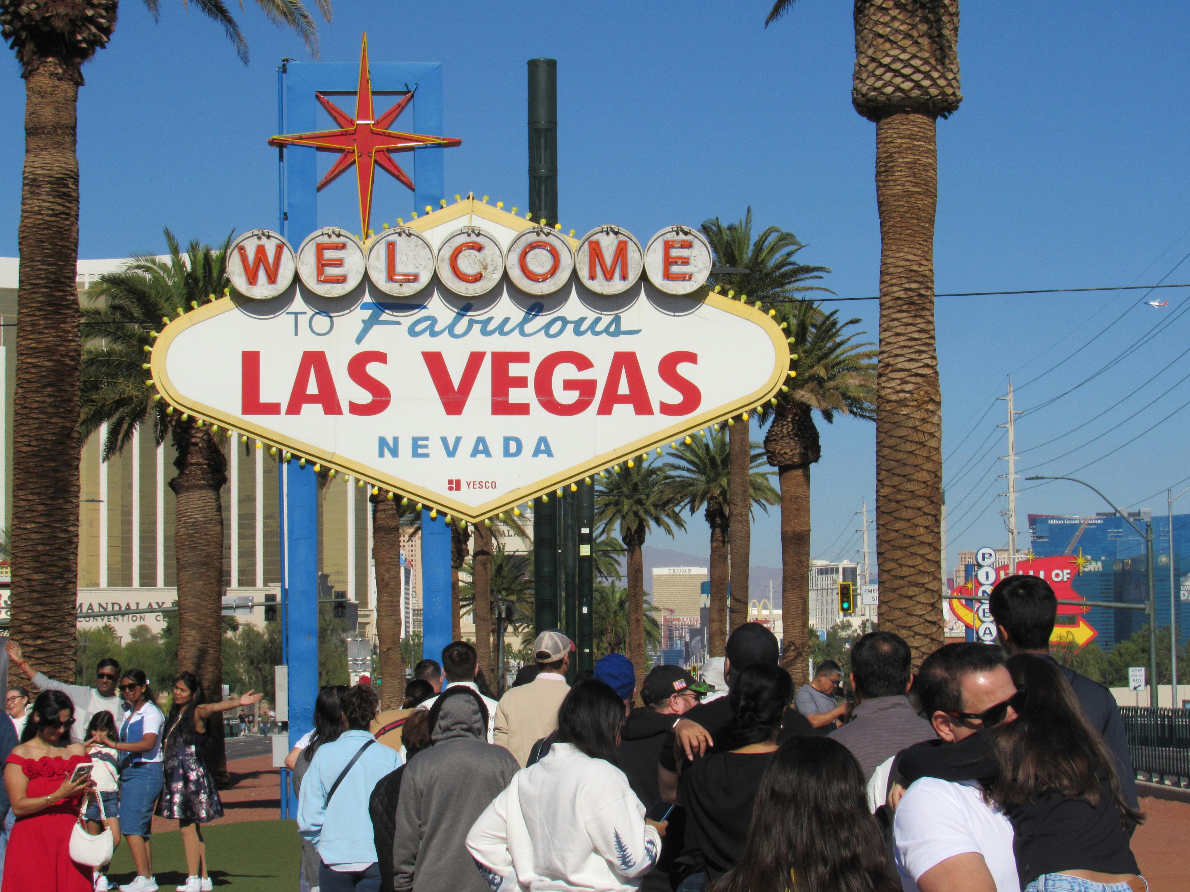 partnership opportunities for US travel agencies mexico - Visitors gather at the famous Welcome to Las Vegas sign, a must-see landmark in Nevada.