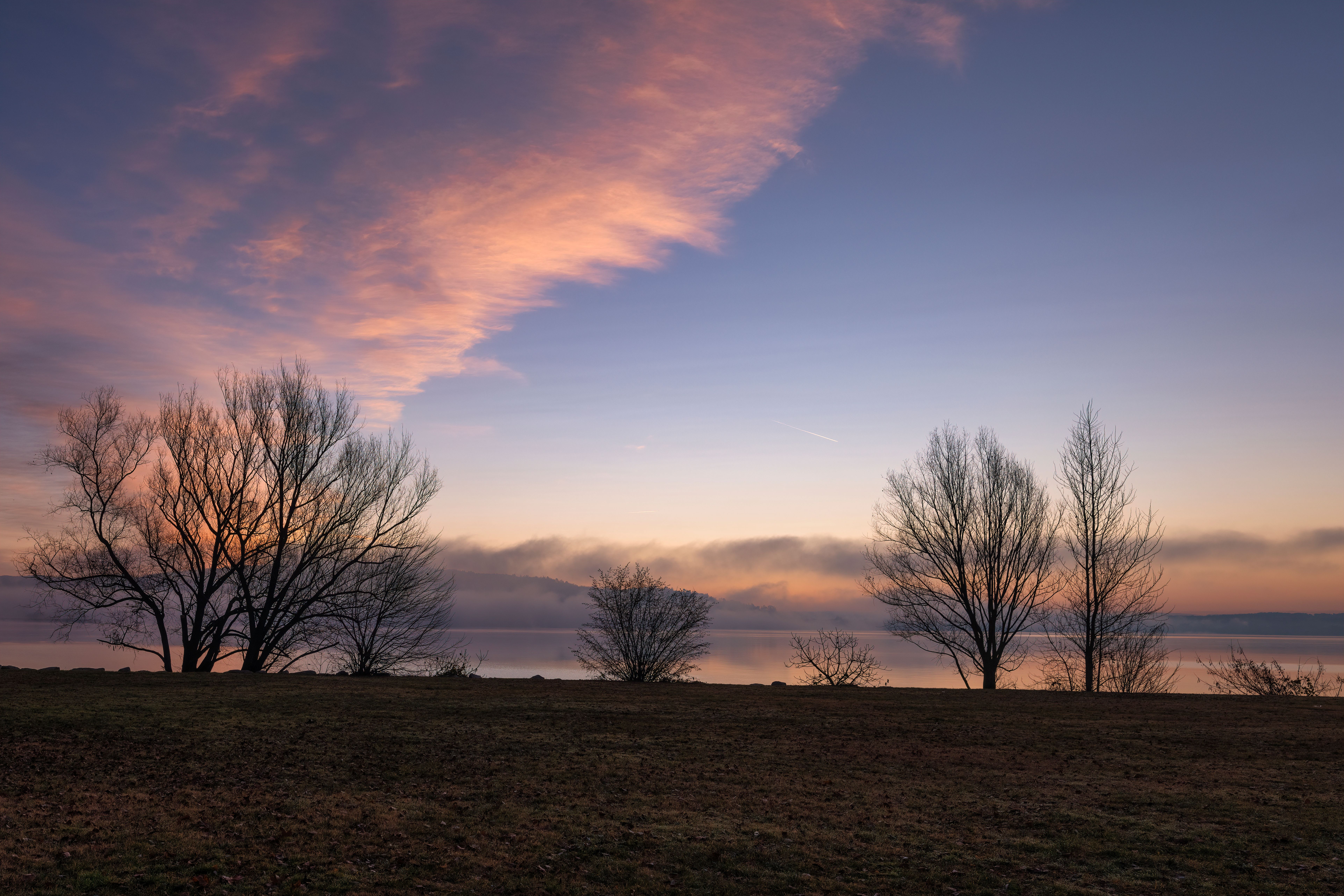 Serene Sunrise Over a Tranquil Lake · Free Stock Photo