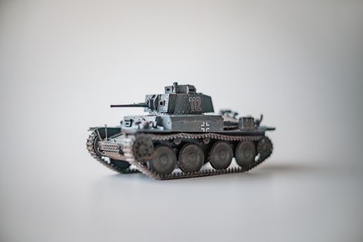 Detailed model of a WWII German tank on a white surface, perfect for historical enthusiasts.