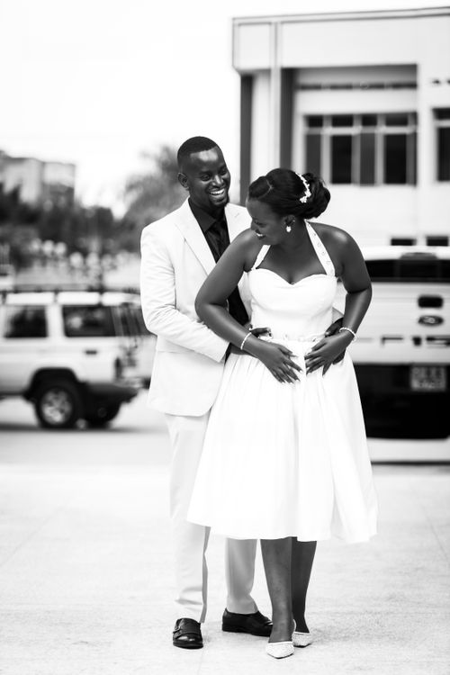 Free Happy couple in elegant attire enjoying their wedding day outside. Stock Photo